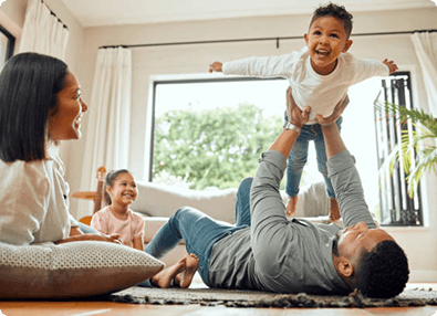 Parent playing with kids at home